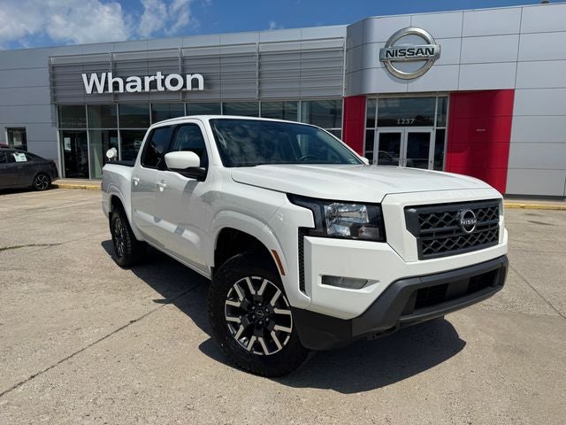 2023 Nissan Frontier SV in Glacier White — front three-quarter view