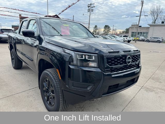 2026 Nissan Frontier SV in Super Black — front three-quarter view