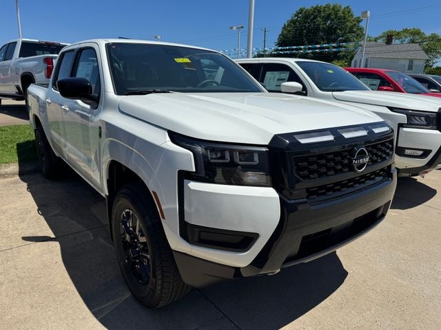 2026 Nissan Frontier SV in Glacier White — front three-quarter view