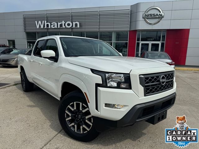 2022 Nissan Frontier SV in Glacier White — front three-quarter view
