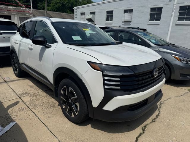 2026 Nissan Kicks SV in Aspen White Tricoat — front three-quarter view