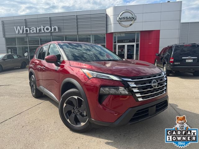 2026 Nissan Rogue SV in Scarlet Ember Tintcoat — front three-quarter view
