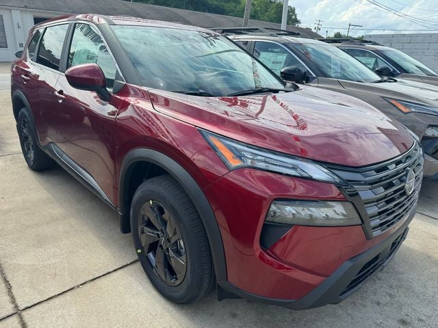 2026 Nissan Rogue SV in Scarlet Ember Tintcoat — front three-quarter view
