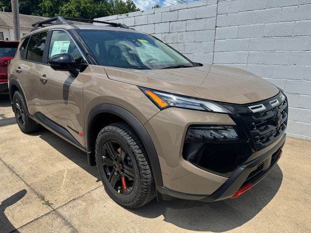 2026 Nissan Rogue Rock Creek in Baja Storm Metallic — front three-quarter view