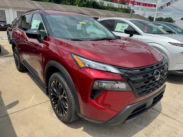 2026 Nissan Rogue Dark Armor in Scarlet Ember Tintcoat — front three-quarter view