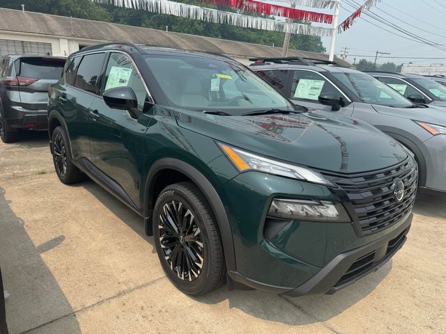 2026 Nissan Rogue Dark Armor in Obsidian Green — front three-quarter view