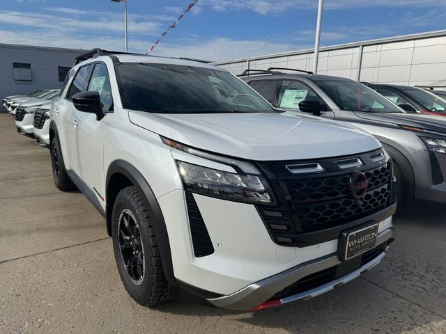 2026 Nissan Pathfinder Rock Creek in Everest White Pearl Tricoat — front three-quarter view